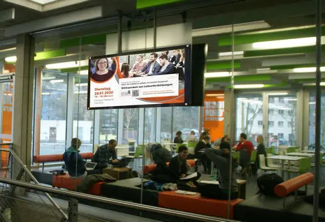 Digital screens in university corridor