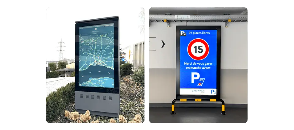 Digital arrival signage in parking area showing welcome info